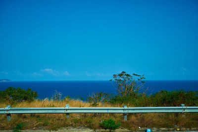 Scenic view of sea against blue sky