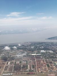 Aerial view of cityscape against sky