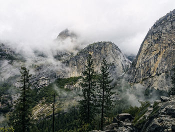 Scenic view of mountains against cloudy sky