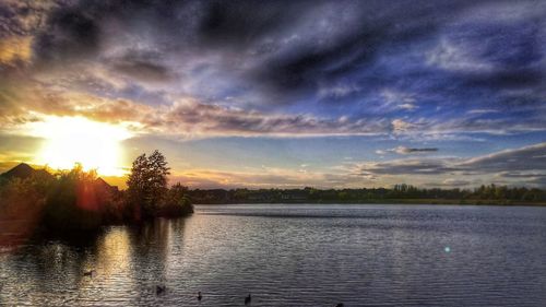 Scenic view of lake against sky during sunset