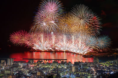 Firework display in sky at night