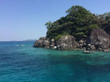 Scenic view of sea against clear blue sky