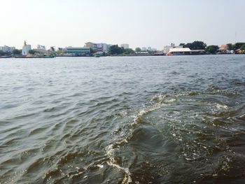 View of sea with buildings in background