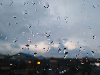 Full frame shot of raindrops on glass window