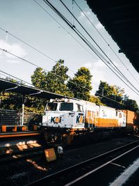 Train on railroad tracks against sky