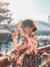 Portrait of young woman standing outdoors