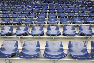 View of blue seats in row