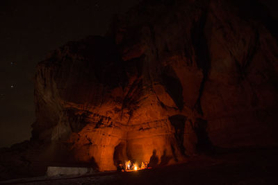 Shadow of people on rock in cave