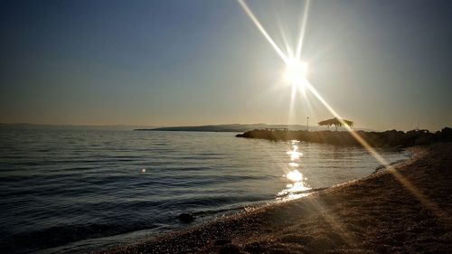 Scenic view of beach at sunset