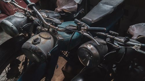 Old motorcycles parked outdoors