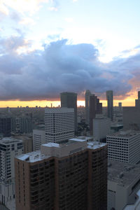 Cityscape against sky during sunset