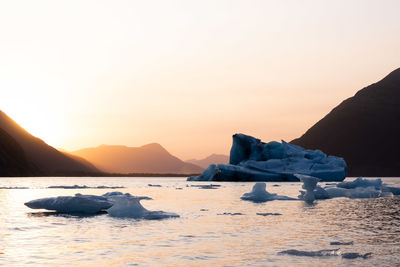 Scenic view of sea against clear sky during sunset