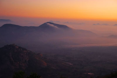 Scenic view of mountains against sky during sunset