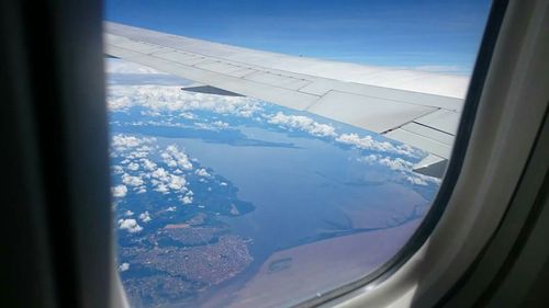 Scenic view of landscape seen through airplane window