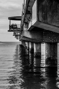Pier over sea against sky