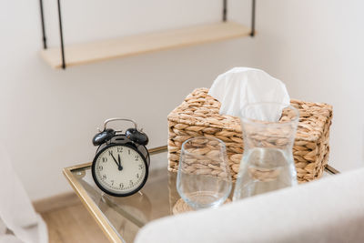 Close-up of alarm clock on table