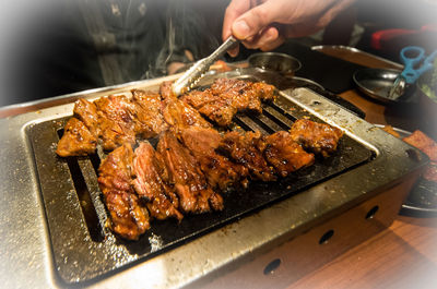 Close-up of meat on barbecue grill