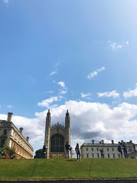 Buildings against cloudy sky