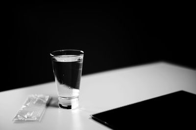 Drinking water in glass on table