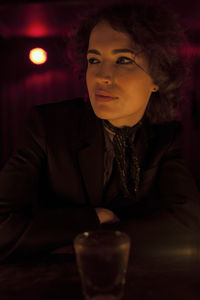 Woman enjoying a drink at a bar