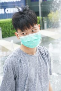 Portrait of young man standing outdoors