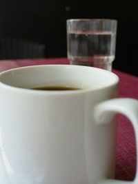 Close-up of coffee cup on table