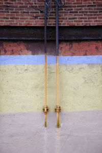 Electric lamp on brick wall