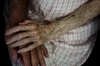 Close-up of senior couple holding hands