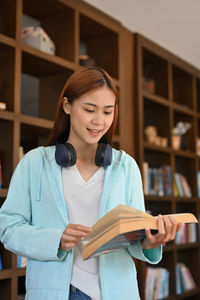 Young woman reading book