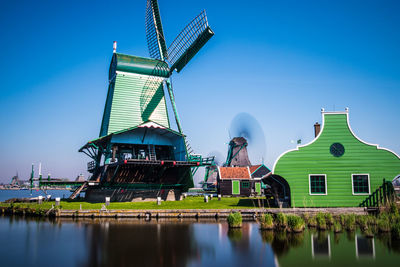 Traditional windmill against blue sky