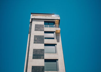 Low angle view of building against blue sky