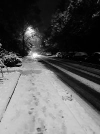 Snow covered road against sky