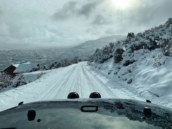 Panoramic view of snow covered mountain against sky