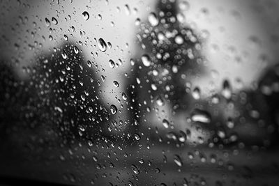 Close-up of raindrops on glass window