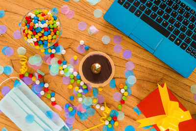 High angle view of multi colored candies on table