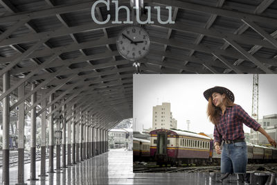 Young man standing on railroad station platform