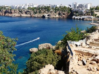 High angle view of townscape by sea