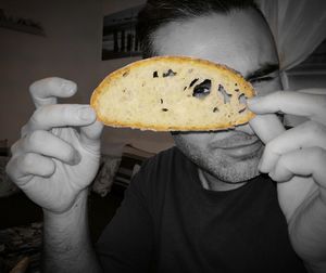 Close-up of man eating food