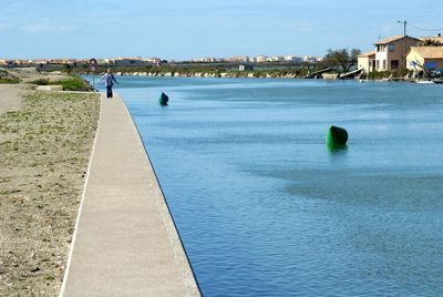 View of river with buildings in background