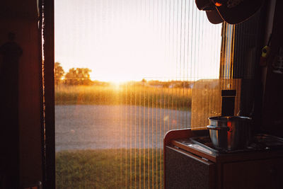 Cooking in a caravan during sunset 