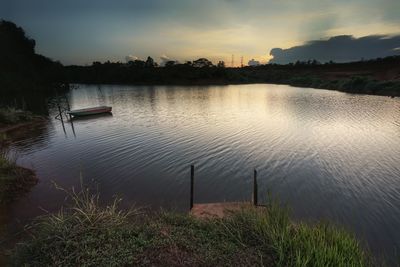 Scenic view of lake against sky during sunset