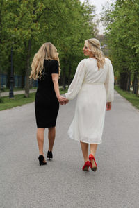 Rear view of women walking in park