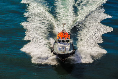 High angle view of boat sailing in sea