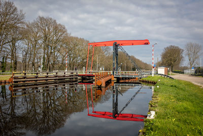 Beautiful drawbridge with a  water reflection over the canal close to the village 'stad van gerwen' 