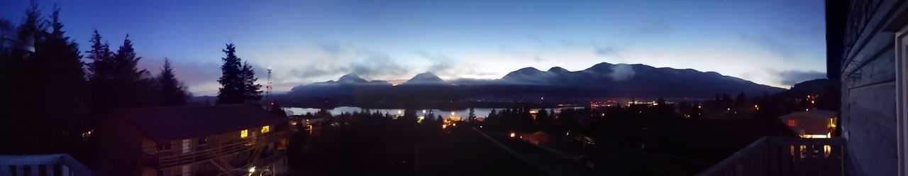 View of illuminated mountain against blue sky