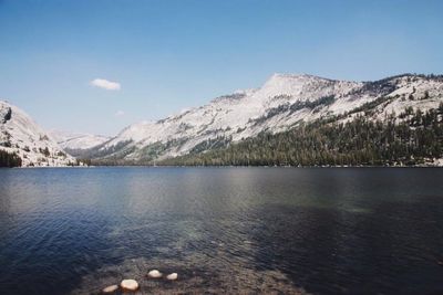 Scenic view of lake and mountains against sky