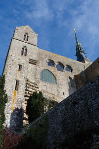 Low angle view of old building against sky