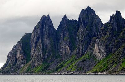 Panoramic view of sea and mountains against sky