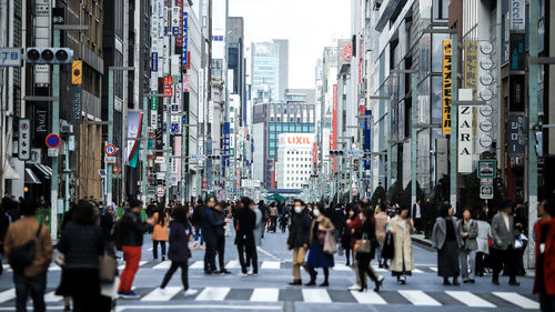 Group of people walking in city