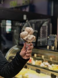 Hand holding ice cream cone